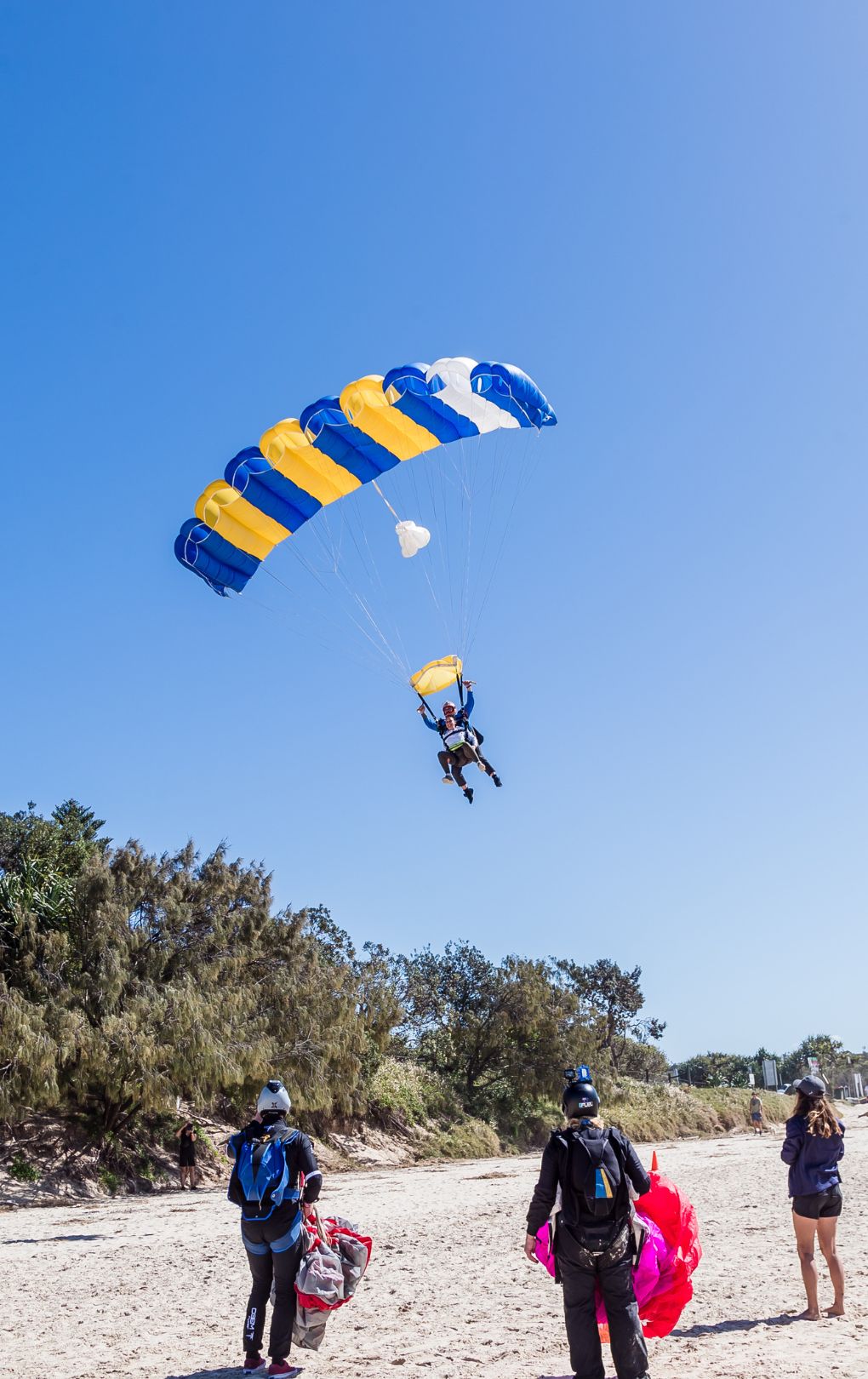 Skydiving parachute landing on beach